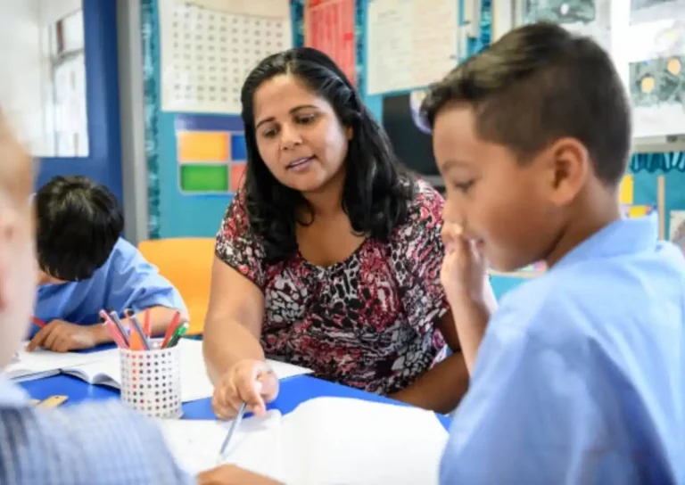 a_teacher_helping_on_assignment